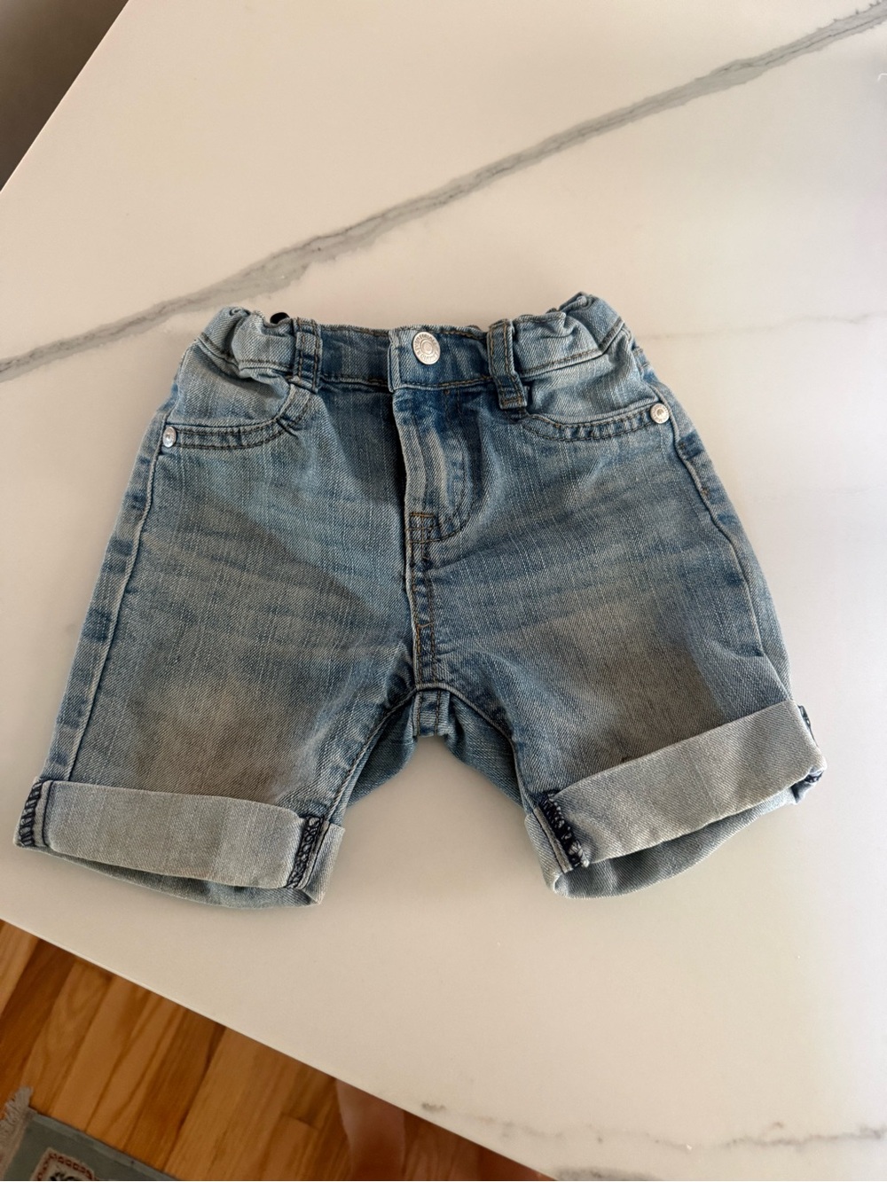 7 for all mankind light wash denim rolled-hem shorts